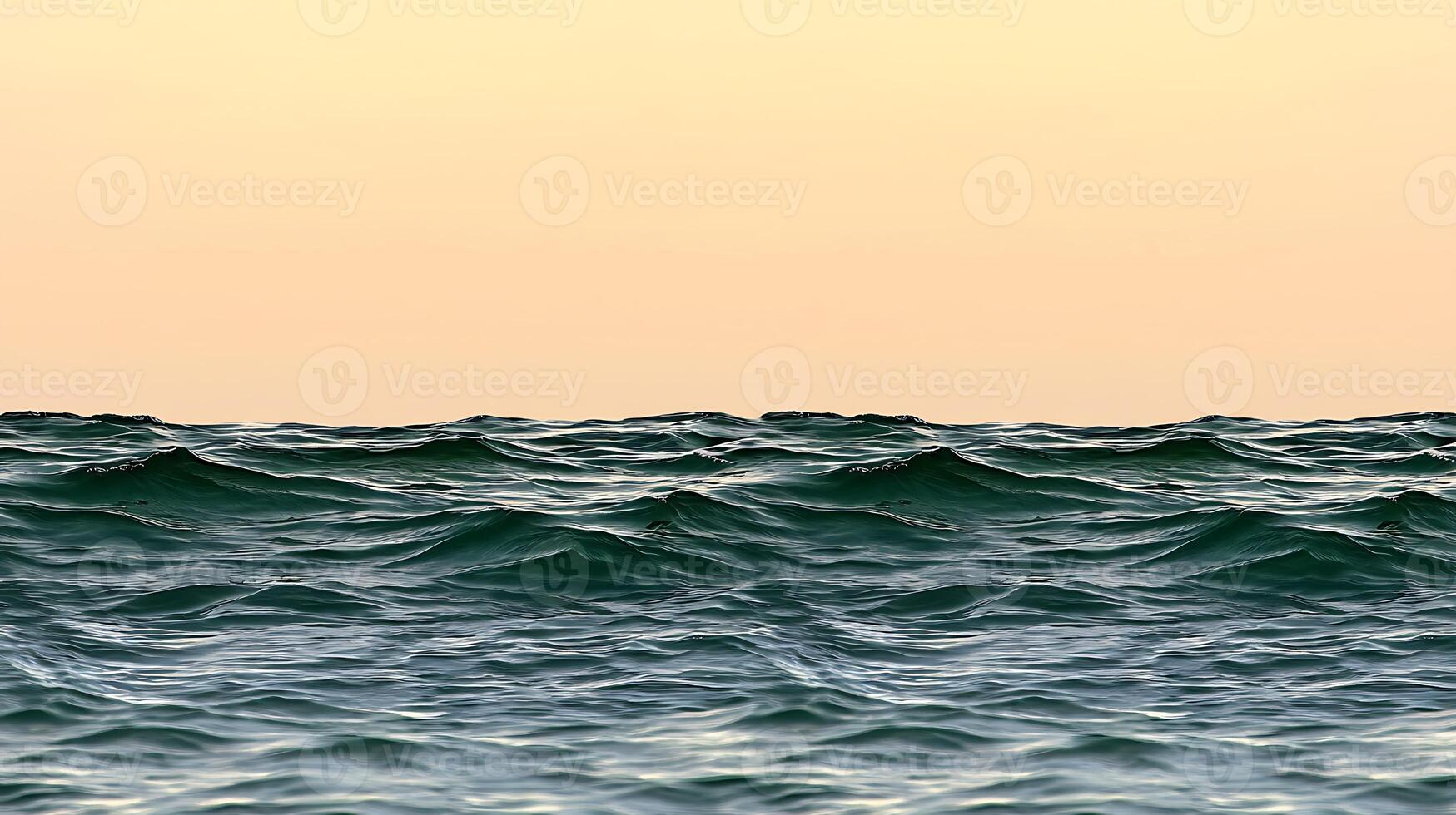 A view of the ocean at sunset with waves photo