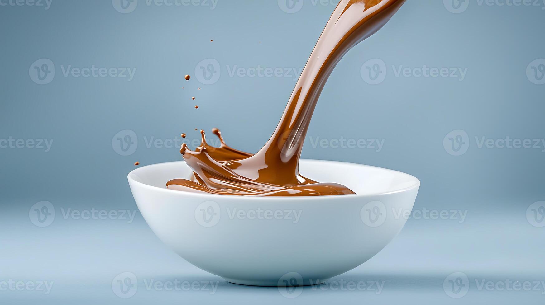 Chocolate being poured into a bowl photo