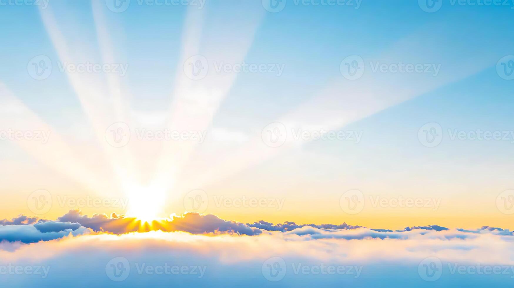 Sun shining over clouds with sun rays photo