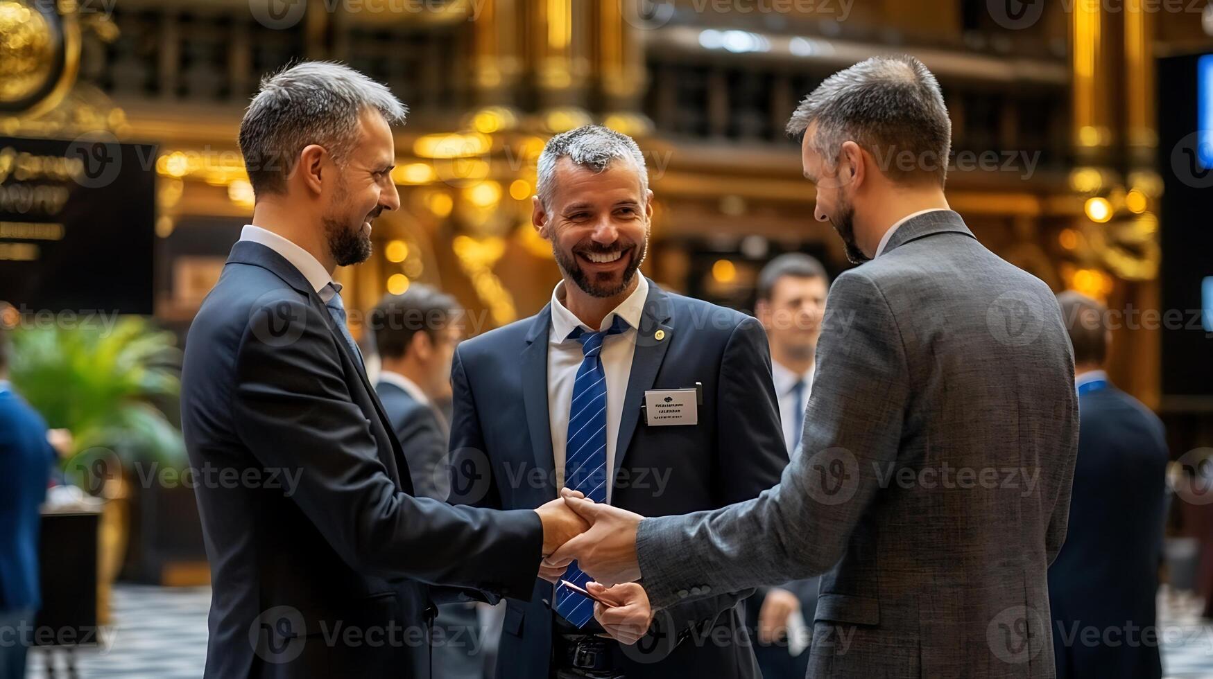 Three men shaking hands at a business event photo