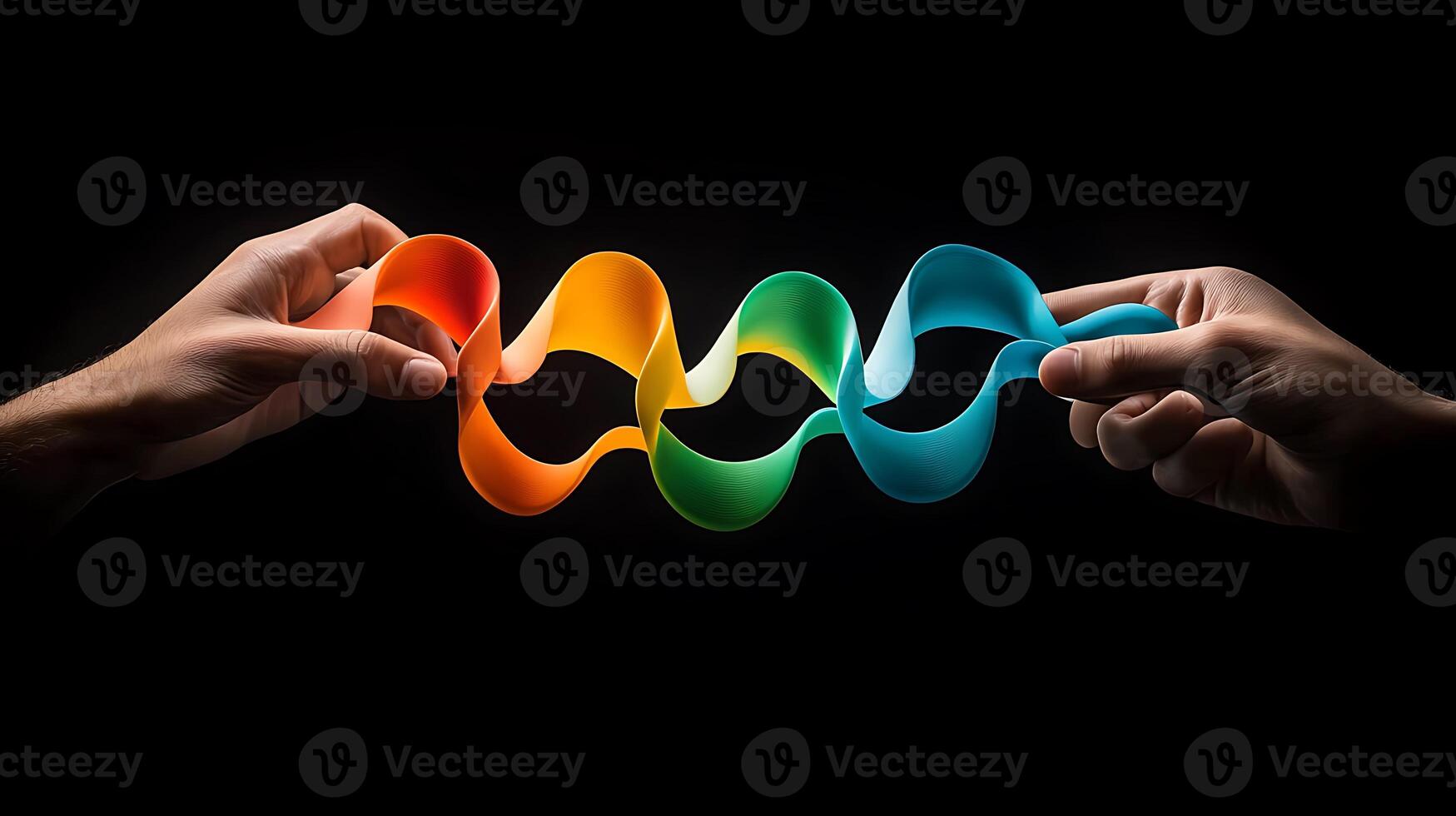 Two hands holding a colorful ribbon photo
