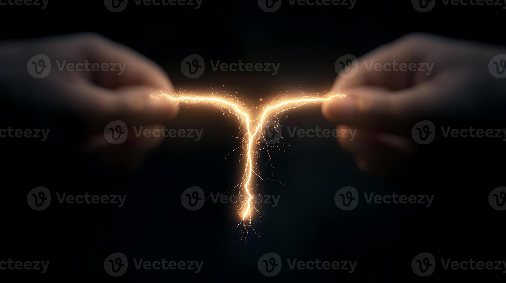 Two hands holding a sparkle in the shape of a letter t photo
