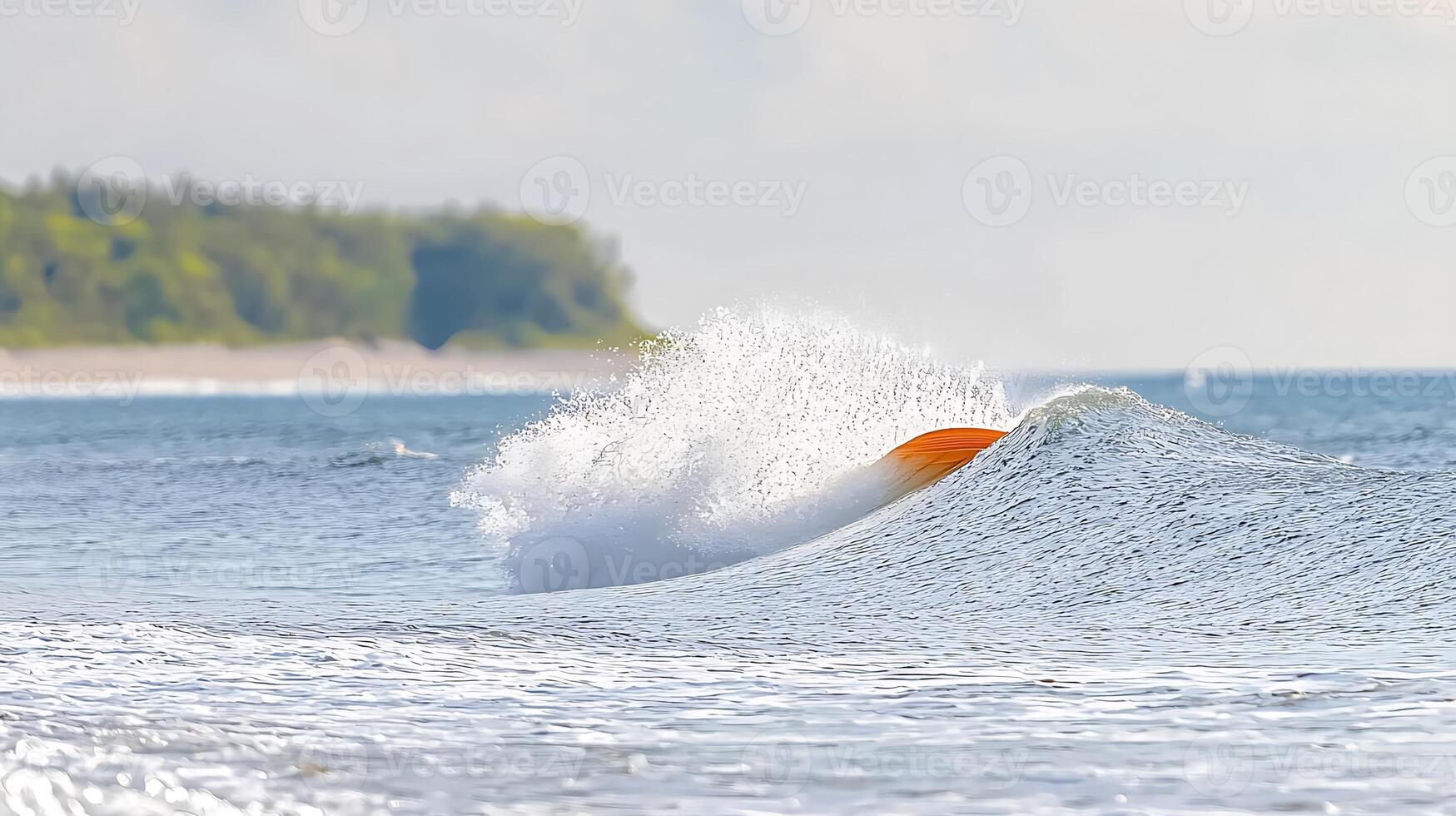 A surfer riding a wave in the ocean photo