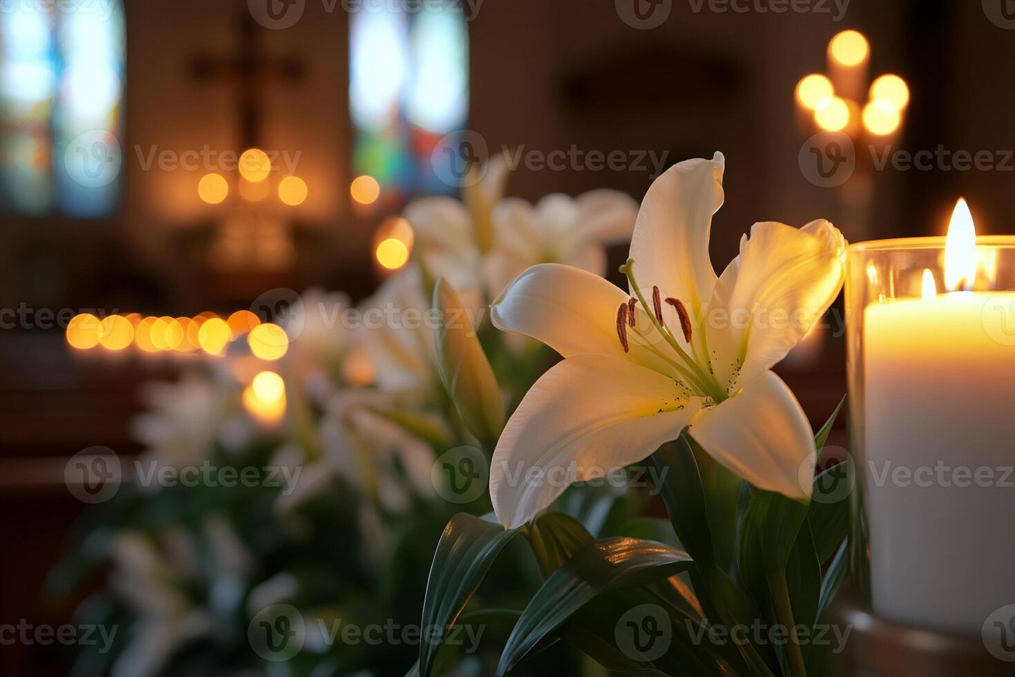 White lilies and lit candles illuminating church interior photo