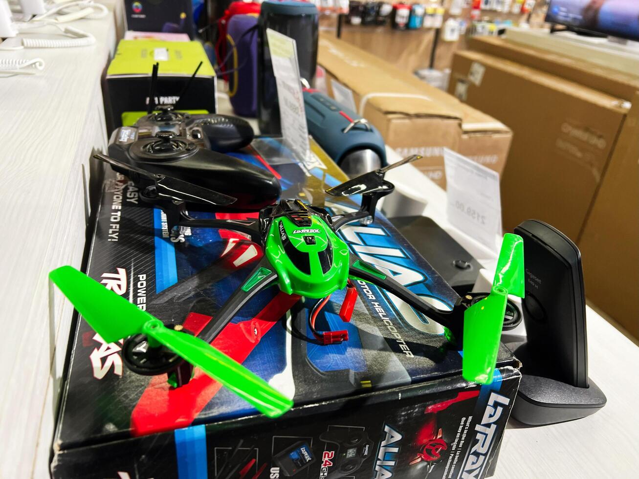 Kyiv, Ukraine - February 04, 2025 Green and black remote controlled drone displayed in a technology store showcase photo