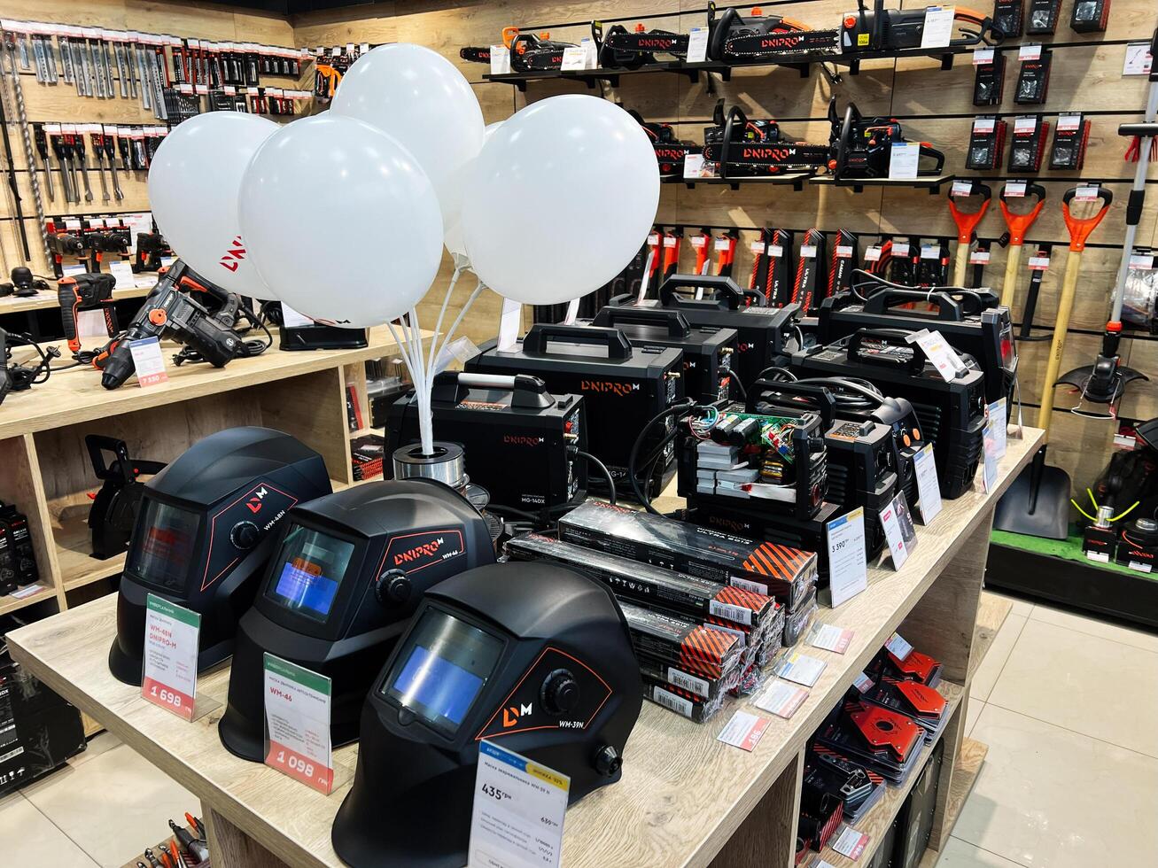 Kyiv, Ukraine - February 04, 2025 Retail display of tools and welding gear with accessories and promotional items photo