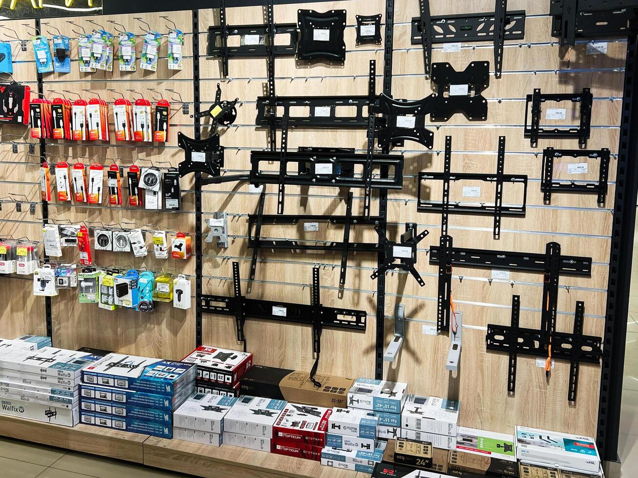 Kyiv, Ukraine - February 04, 2025 Television wall mounts and accessories displayed in a retail store for sale photo