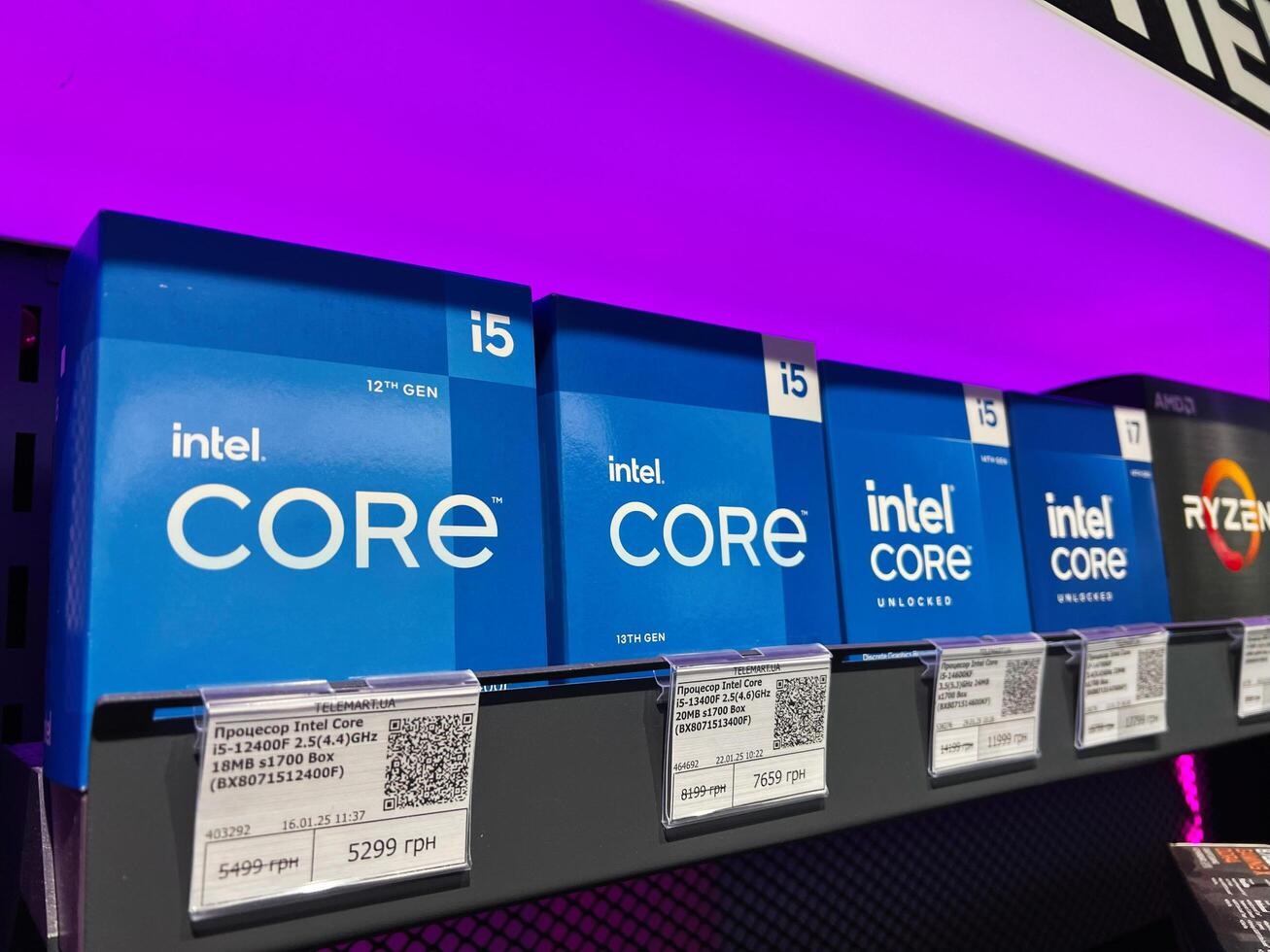 Kyiv, Ukraine - February 04, 2025 Shelves Displaying Intel Core Processors with Pricing at Electronics Store photo