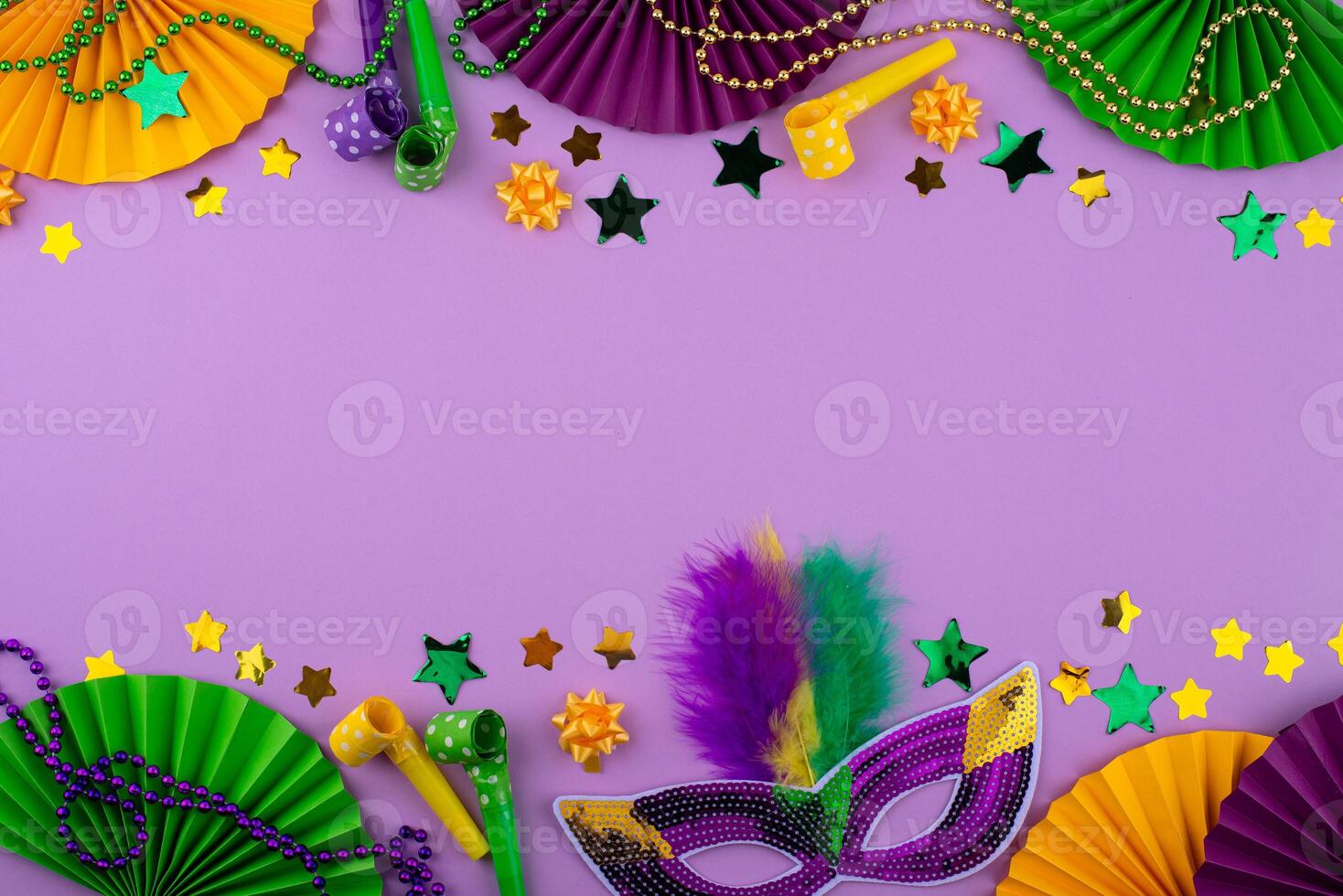 Vibrant Mardi Gras background with mask, beads, and festive decorations photo