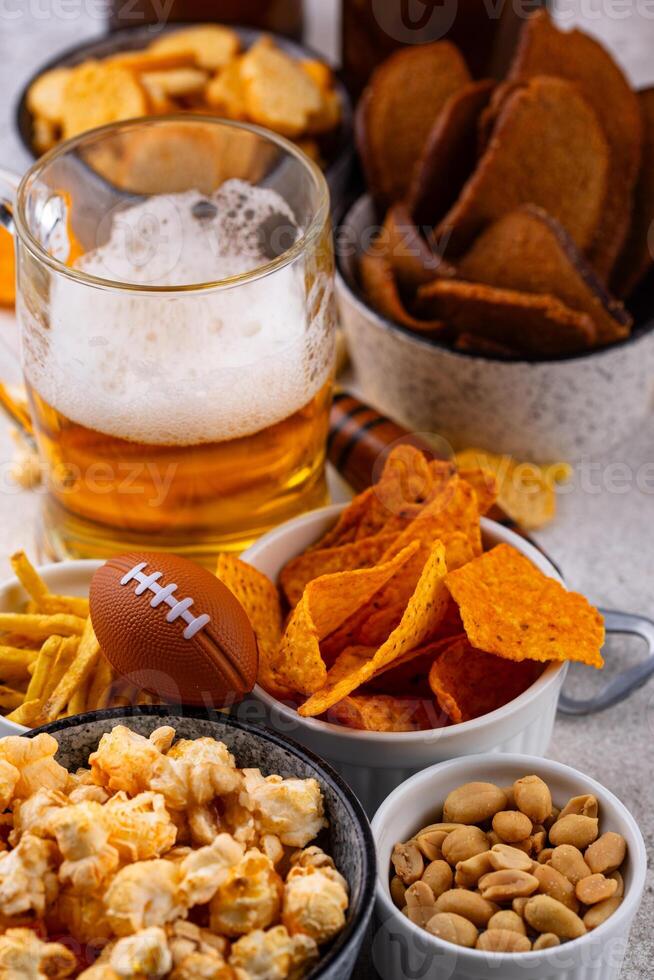 Beer and different snacks for Superbowl or football party photo
