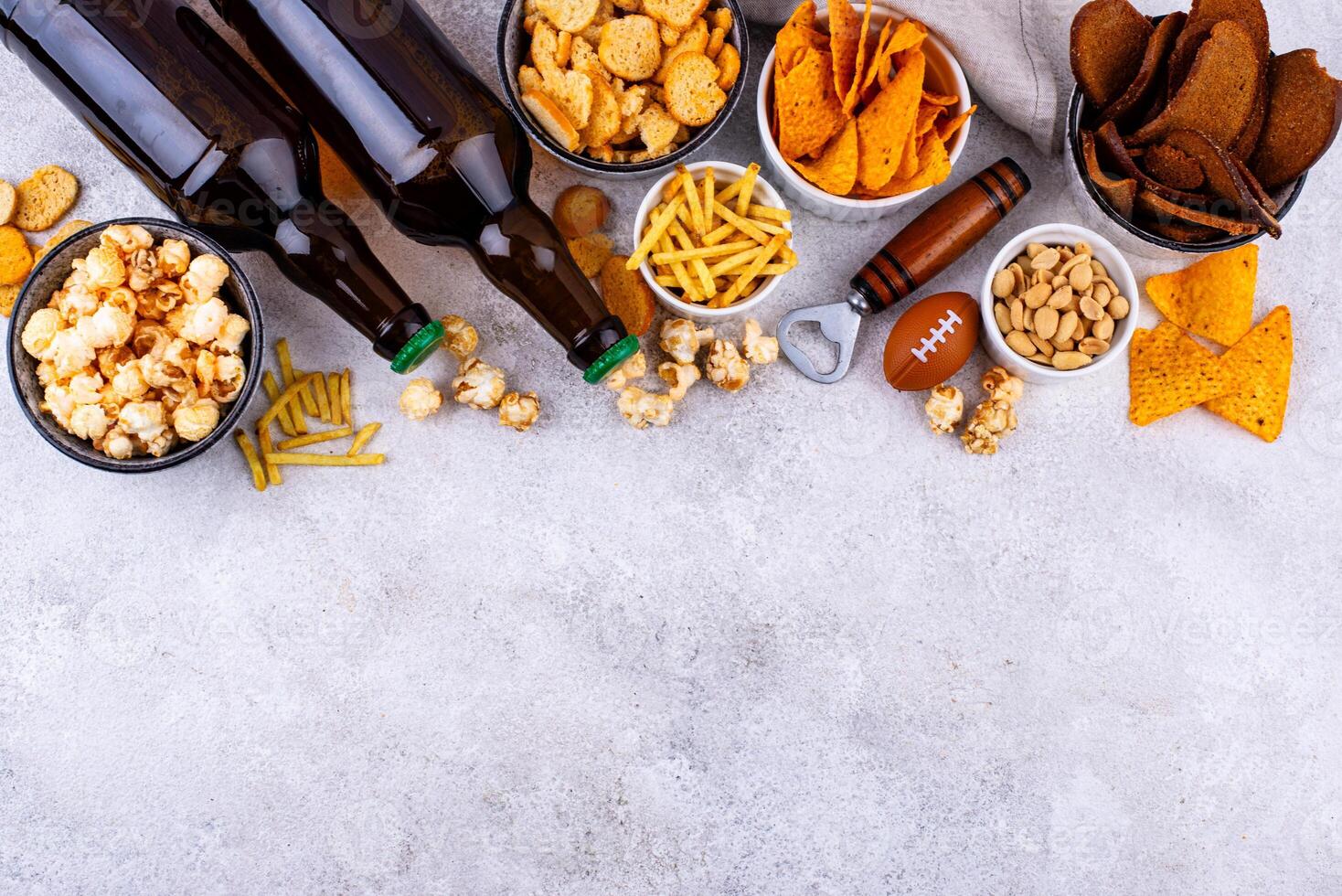Beer and different snacks for Superbowl or football party photo