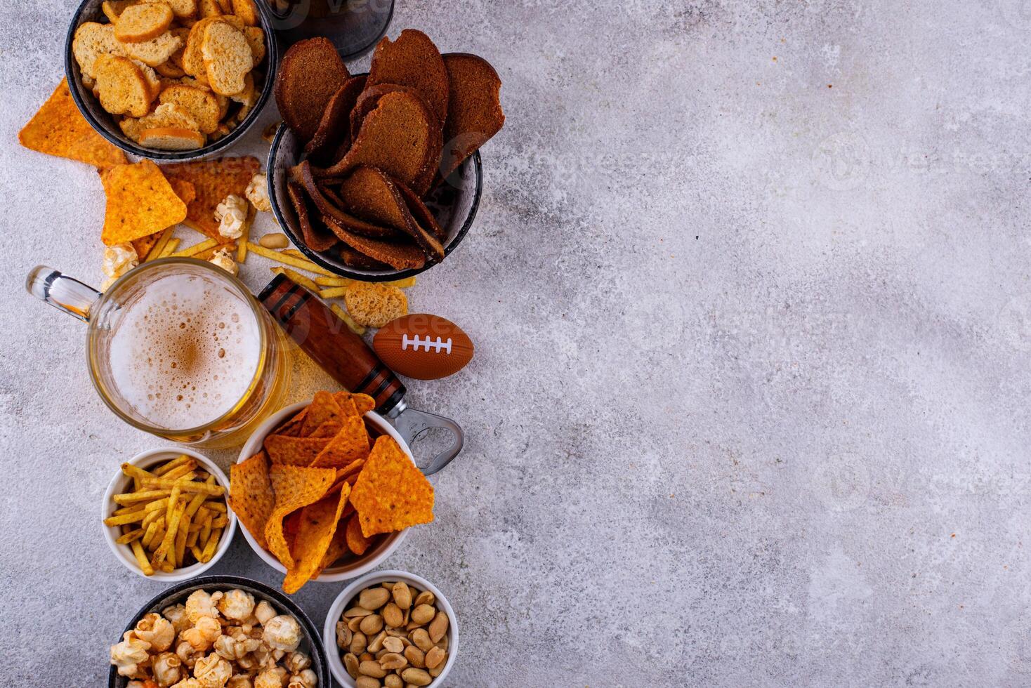Beer and different snacks for Superbowl or football party photo