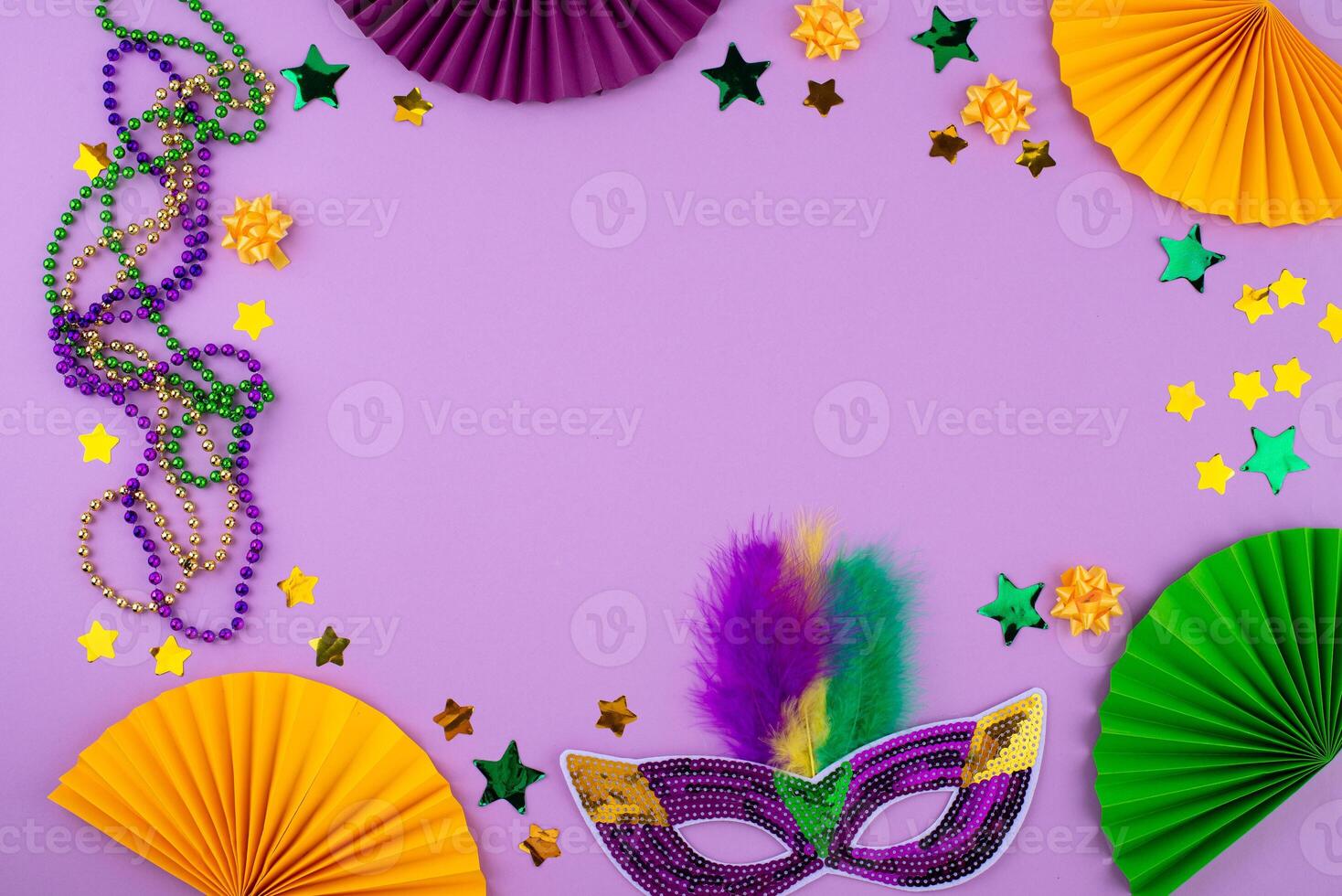 Vibrant Mardi Gras background with mask, beads, and festive decorations photo