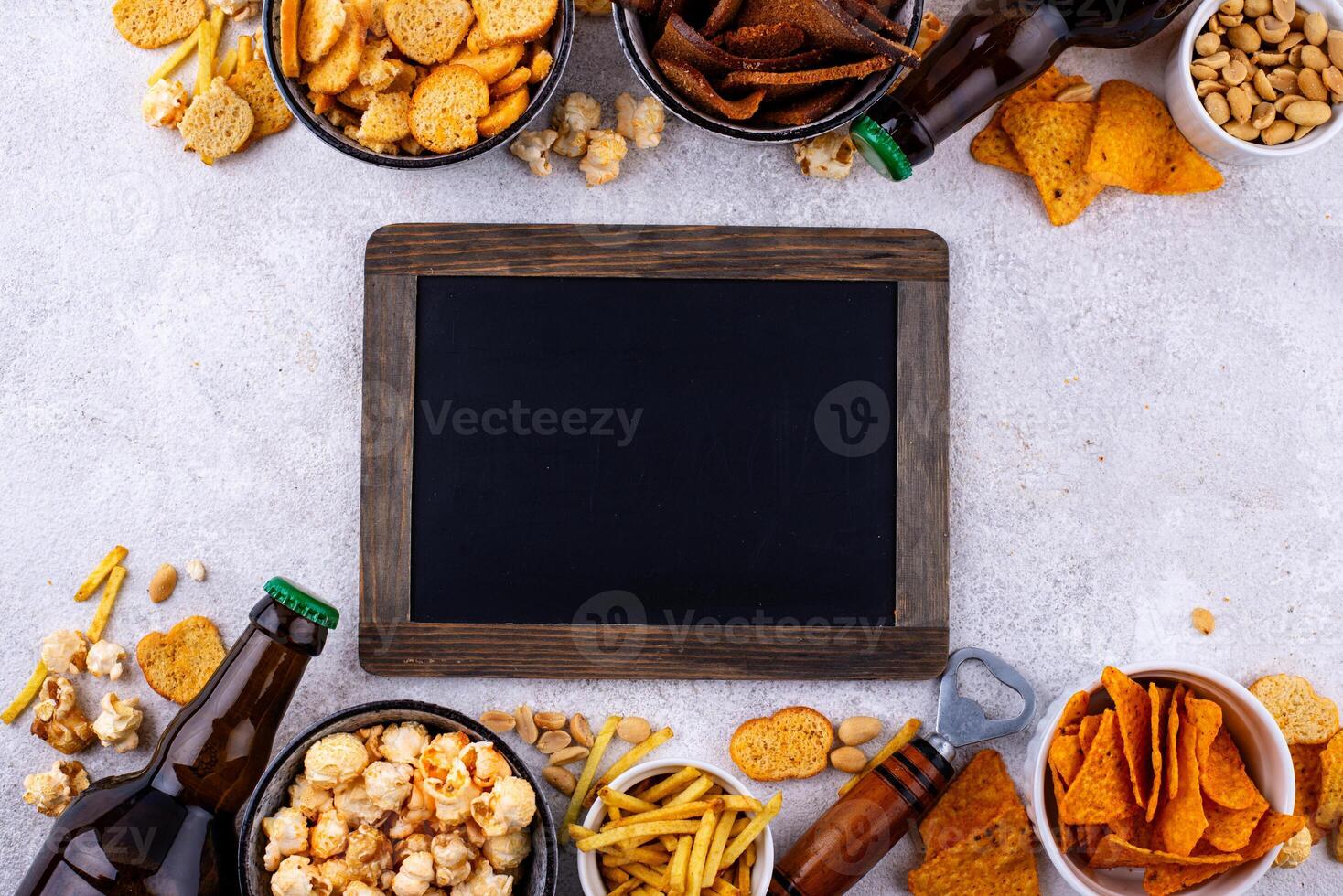 Beer and different snacks for Superbowl or football party photo