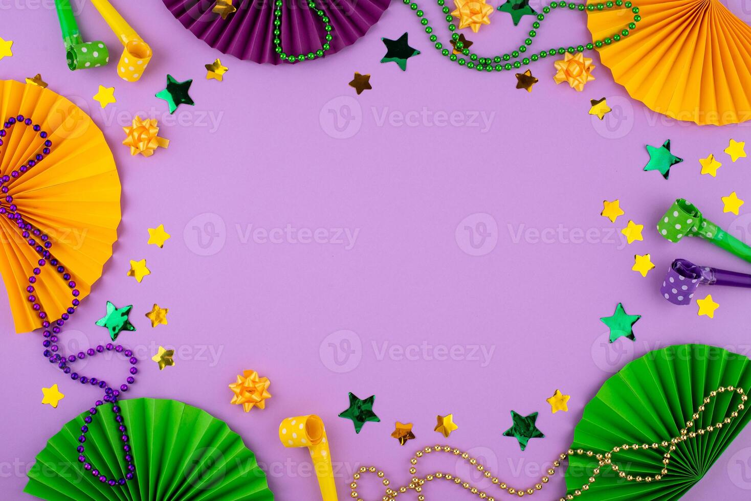 Vibrant Mardi Gras background with mask, beads, and festive decorations photo