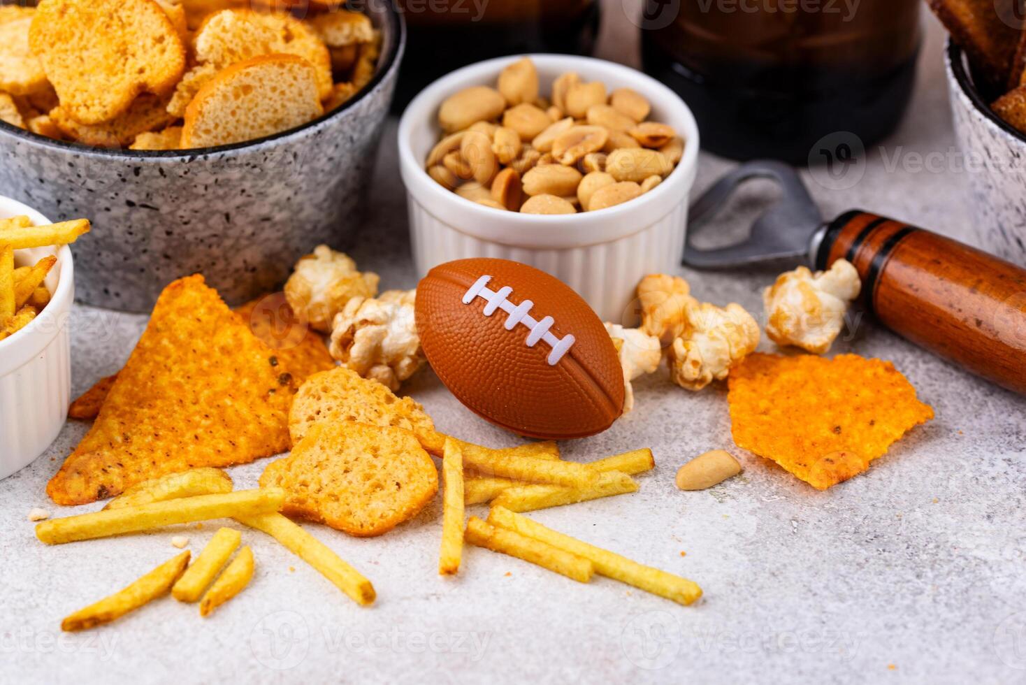 Beer and different snacks for Superbowl or football party photo