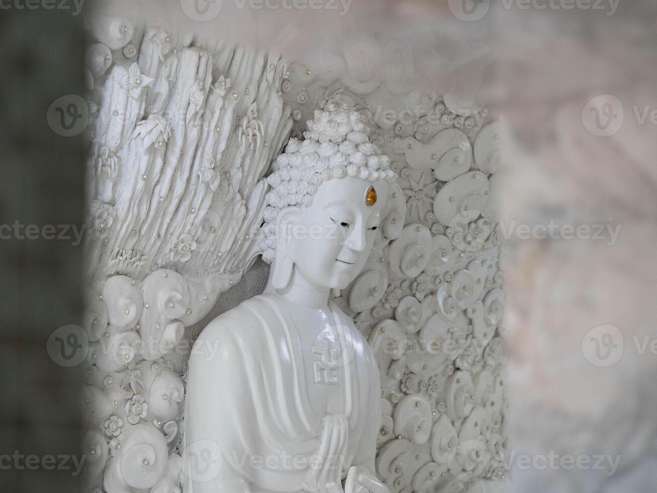 Marble sculpture symbolizing Buddhism in Asia inside temple. photo