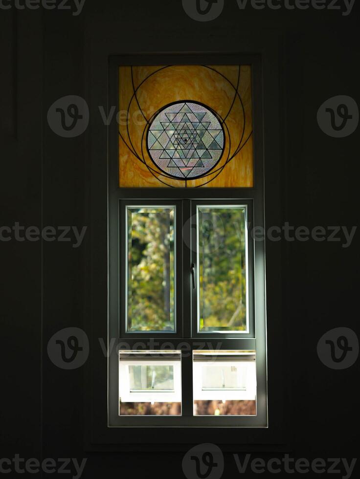 White windows in church with stained glass with various patterns. photo