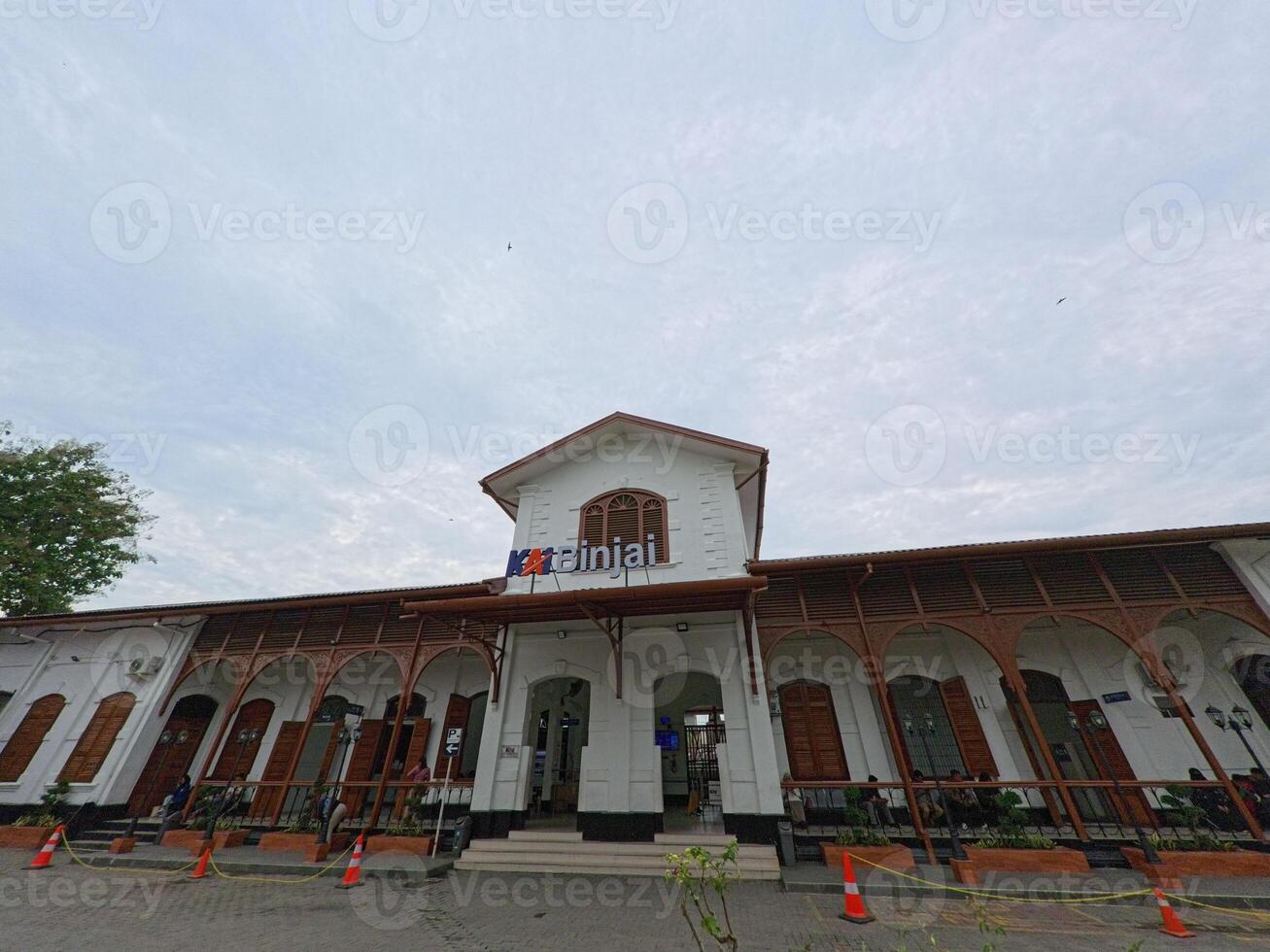Historic Train Station Building with Arched Windows and Sky photo