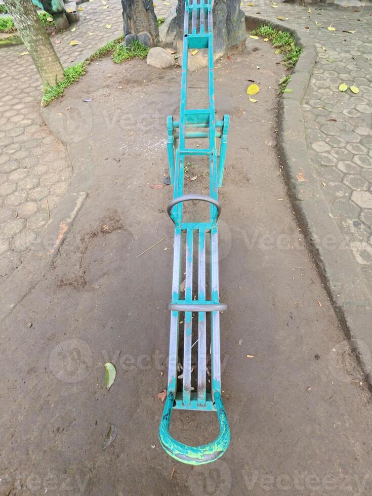 Unique Green Seesaw in the City Park photo