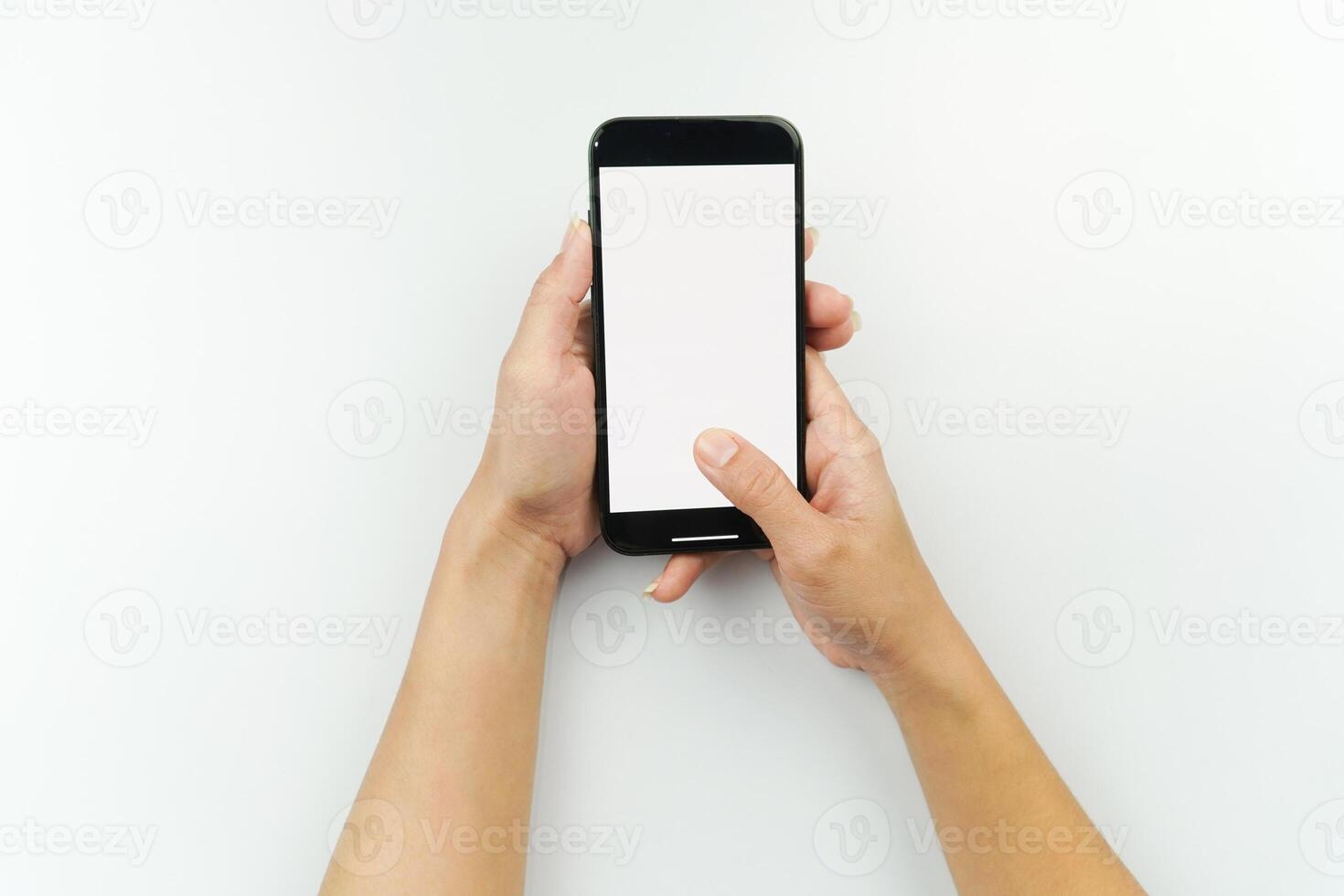 Female hands holding a smartphone with blank screen photo