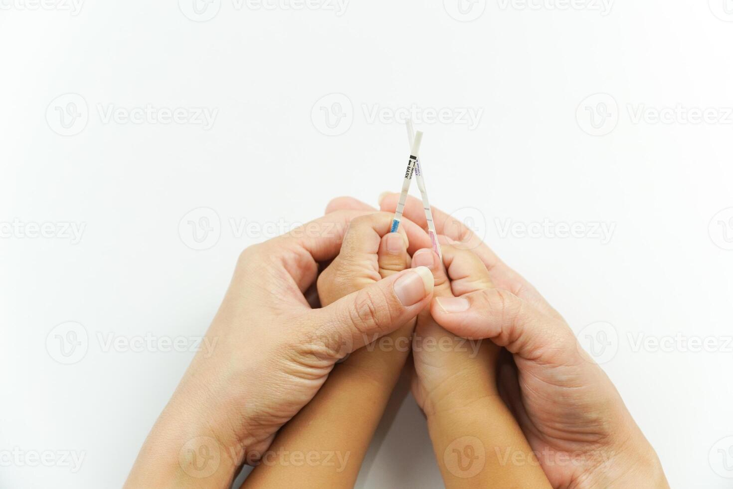 Two hands holding a pair of scissors photo