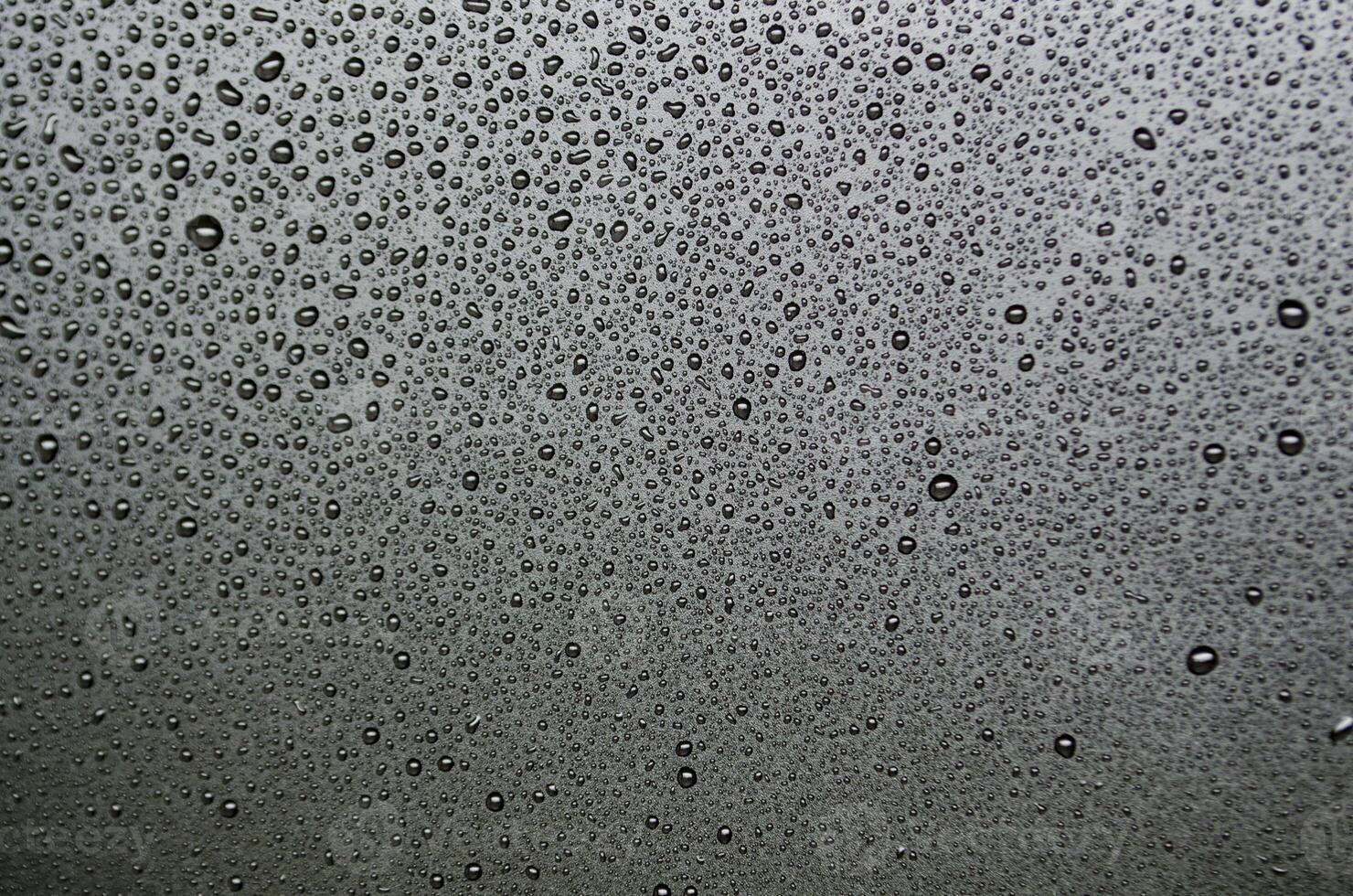 Stright view of water droplets with dark background suitable for wallpaper photo