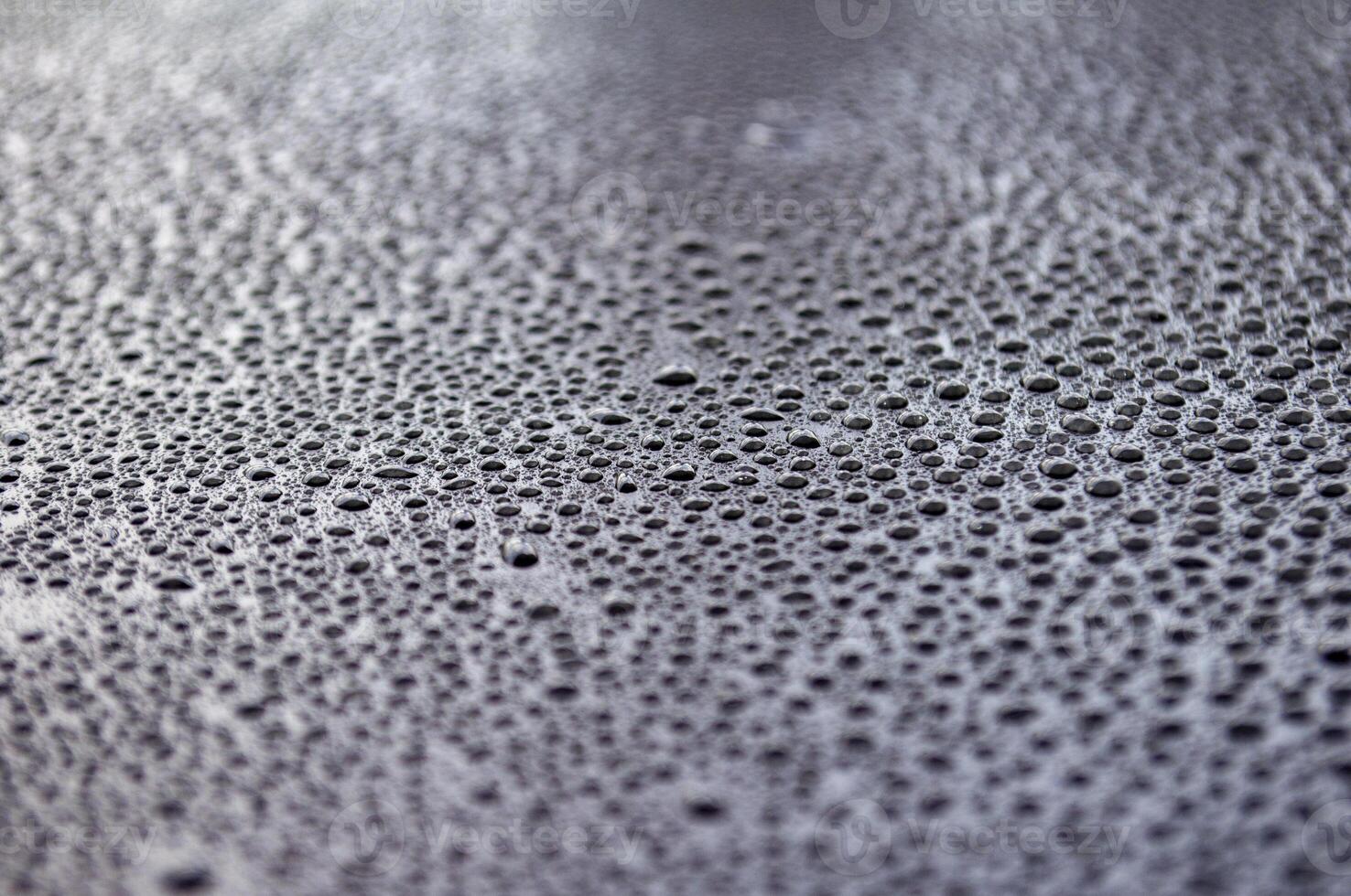 Close up of clear water droplets with black background. Suitable for wallpaper cover design photo