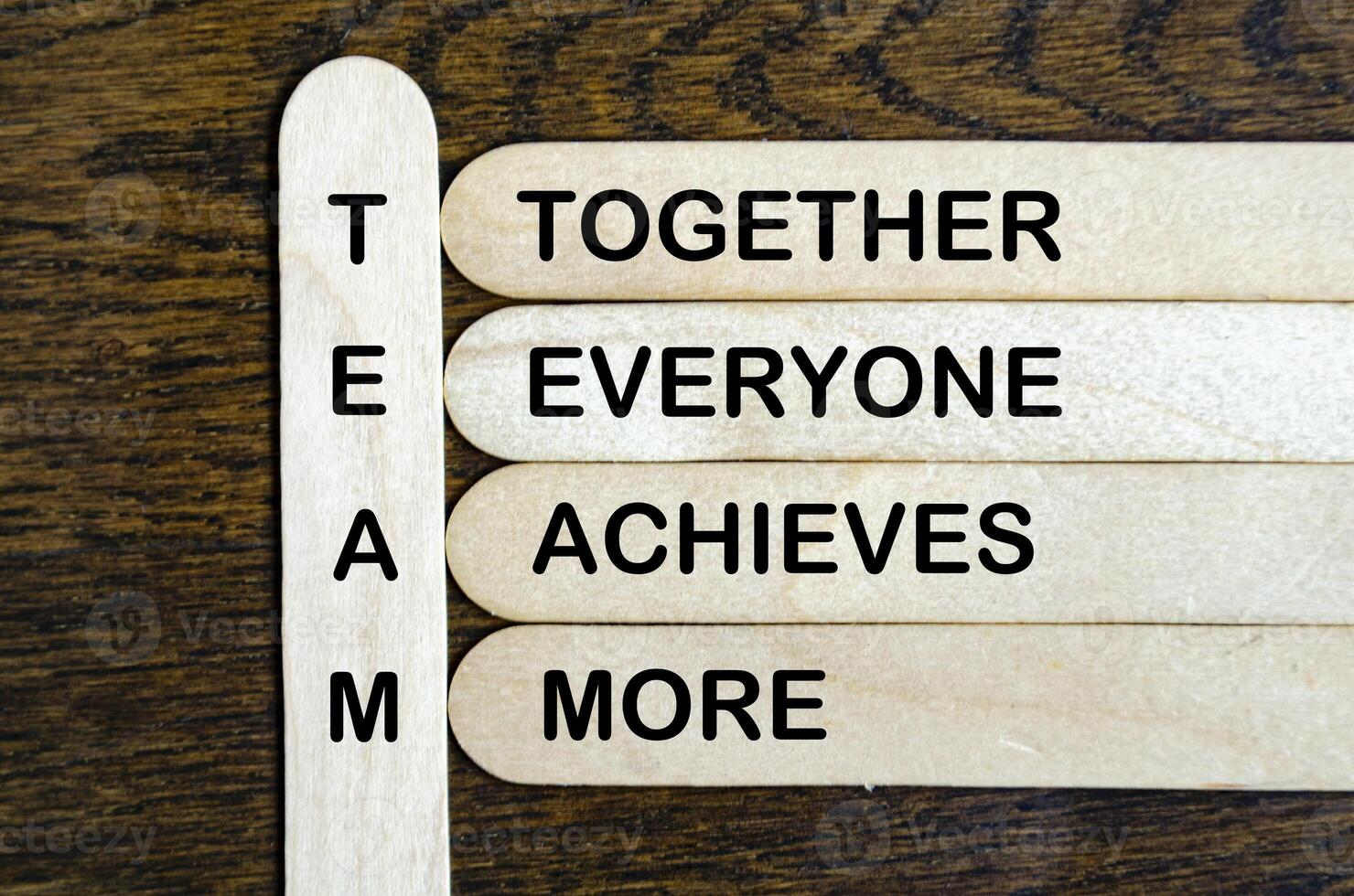 TEAM representing Together Everyone Achieves More text on wooden stick. photo