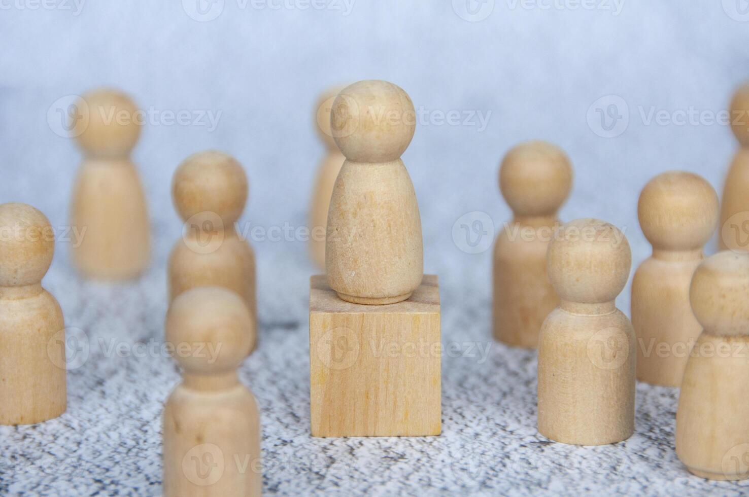 Figure dolls representing followers following a great leader. Leadership concept photo