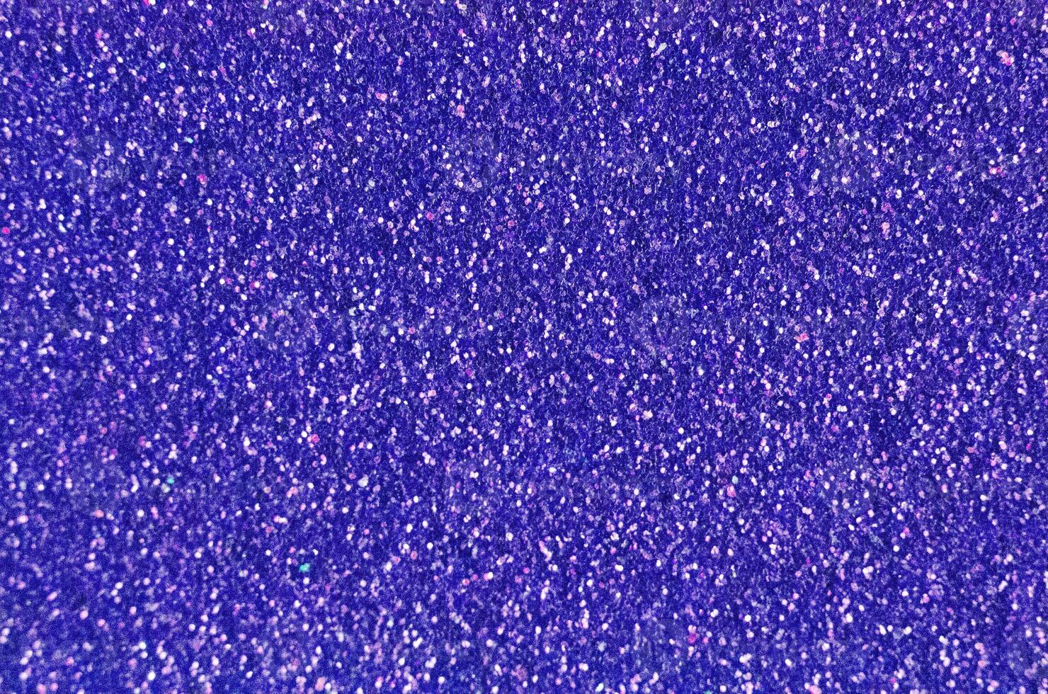 Close up of a dark blue glitter or sparkle texture and can be used as a background or wallpaper for designs. photo