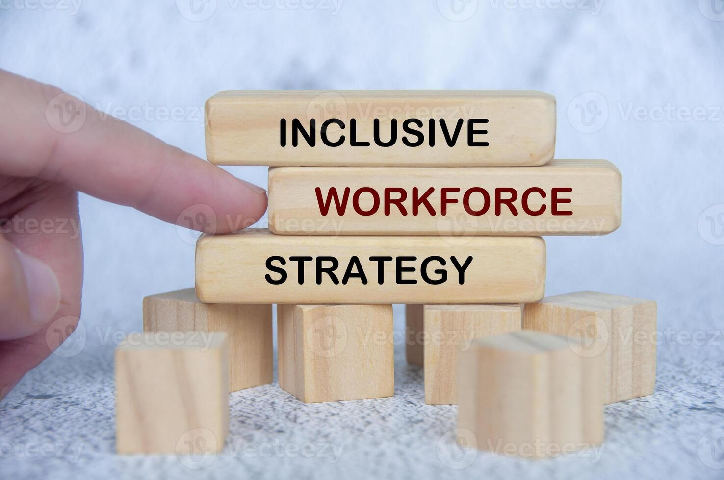 Inclusive Workforce Strategy text on wooden blocks. People first concept in workplace environment photo