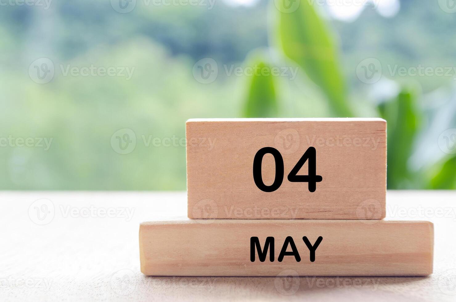 4 May text on wooden blocks with customizable space for text or messages. Month and copy space concept photo