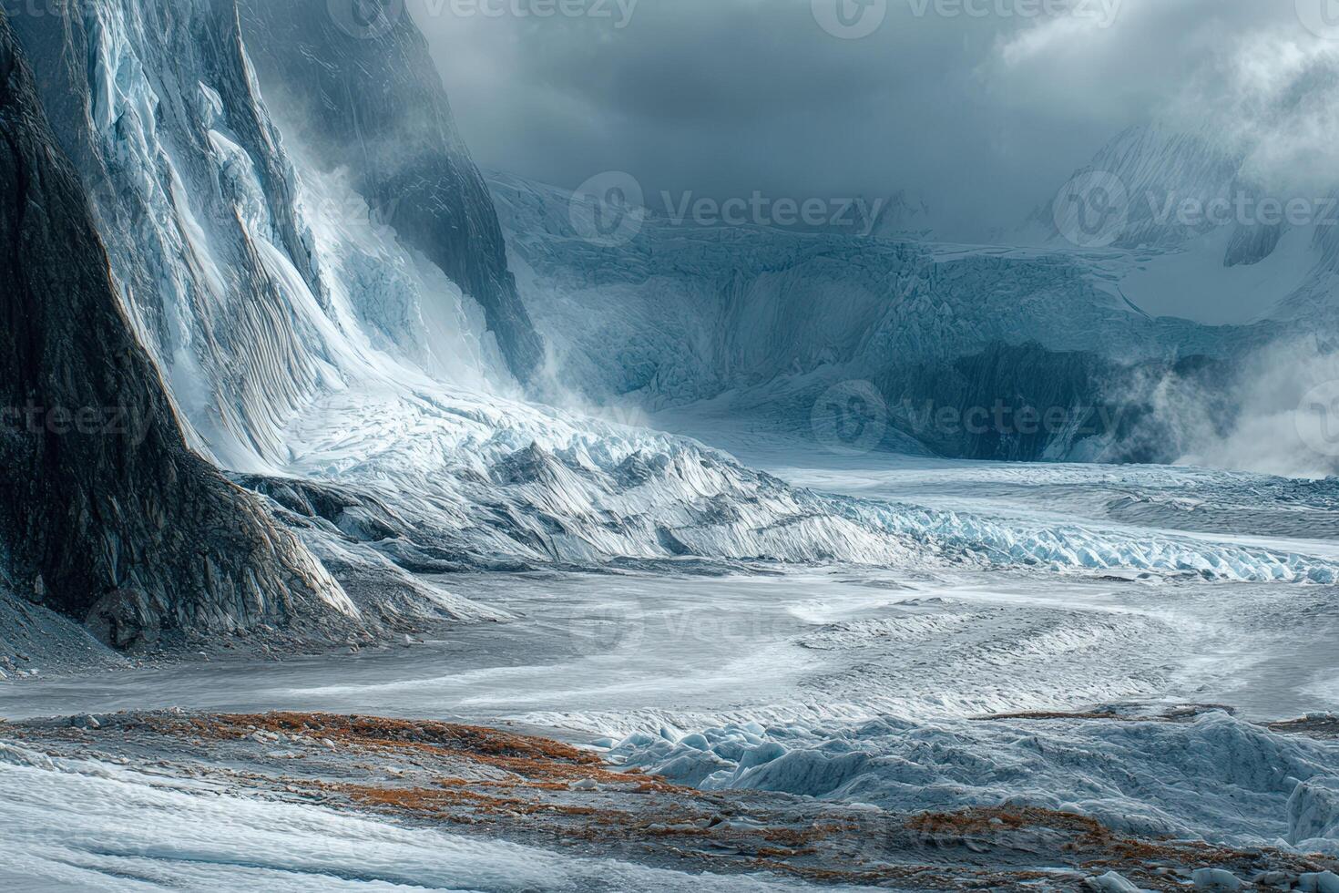 A large glacier is covered in snow and ice photo