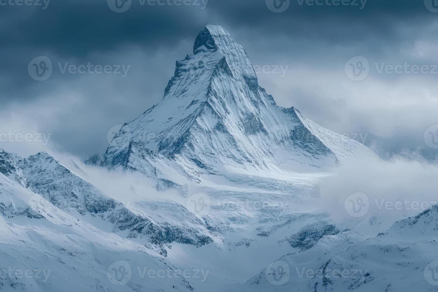 A mountain with snow on it is shown in this photo