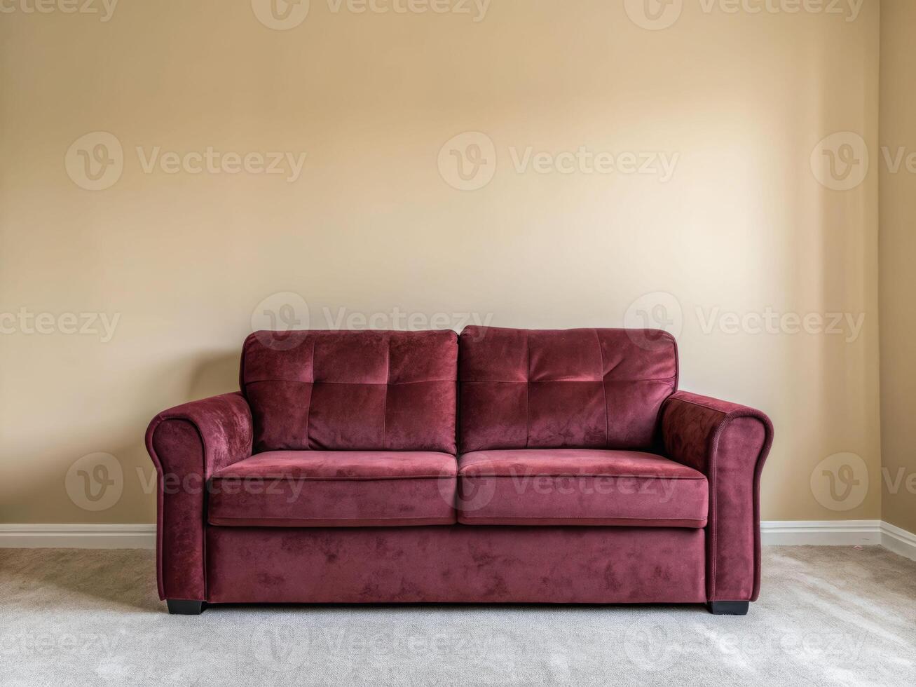 Elegant deep burgundy sofa with plush velvet pillows cozy living room soft furnishings neutral walls inviting atmosphere photo