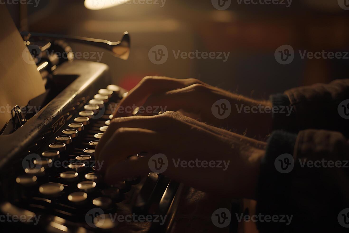A person typing on an old typewriter photo