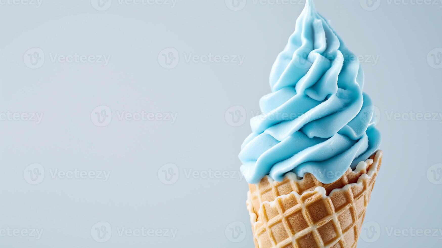 A Sky Blue ice cream cone on a blank white background, summery setting with copy space. photo