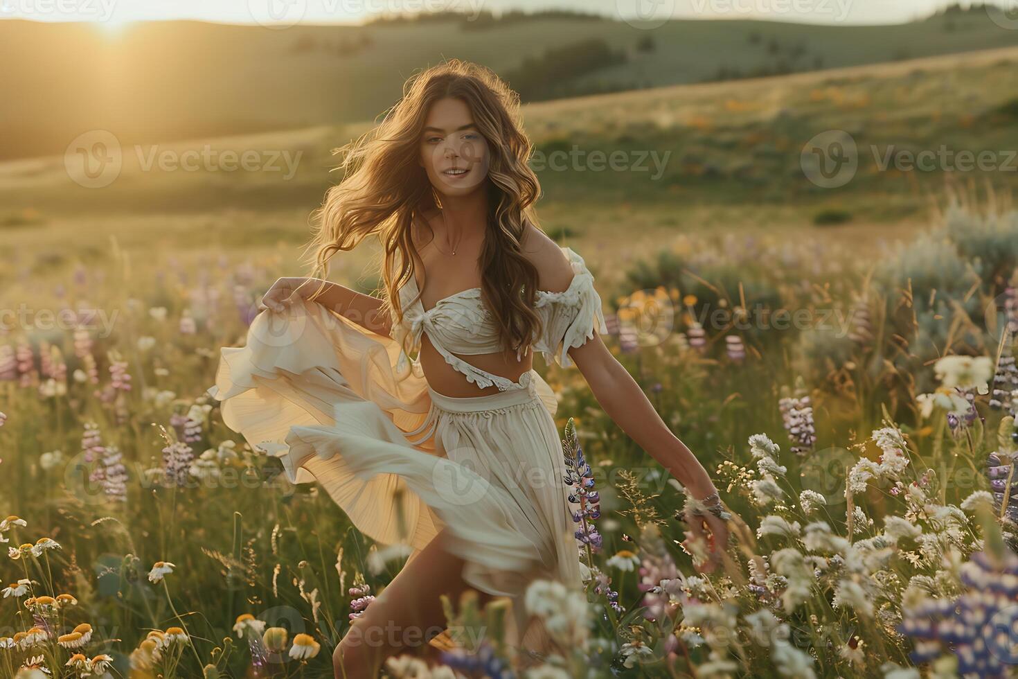 A woman in a white dress is walking through a field of wildflowers photo
