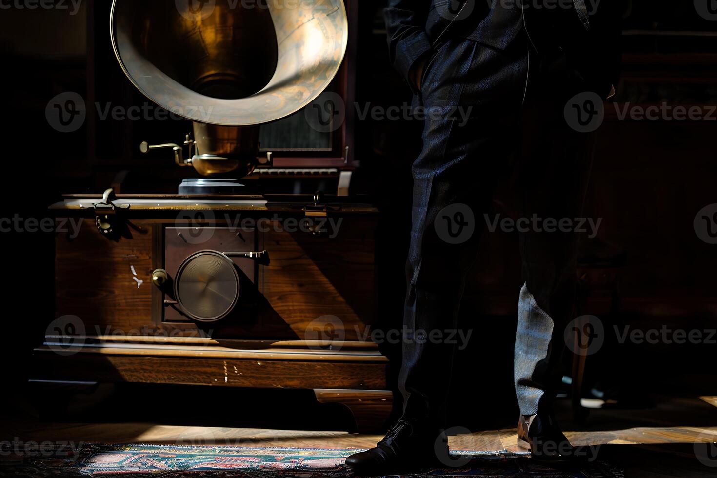 A man in a suit standing next to a gramophone photo
