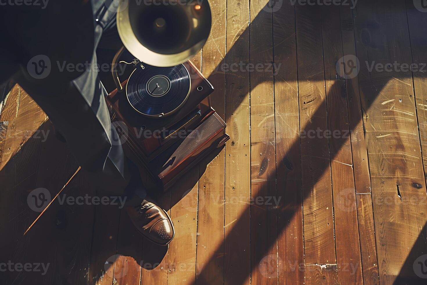 A person in a suit standing on a wooden floor with a record player photo