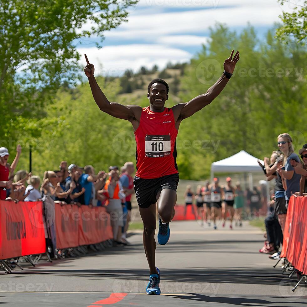 A man running a marathon with his arms up photo
