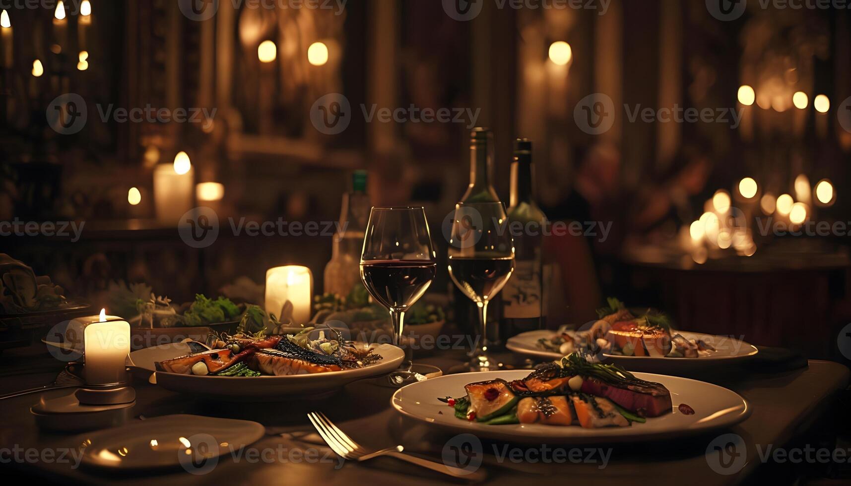 A table with two plates of food and wine photo