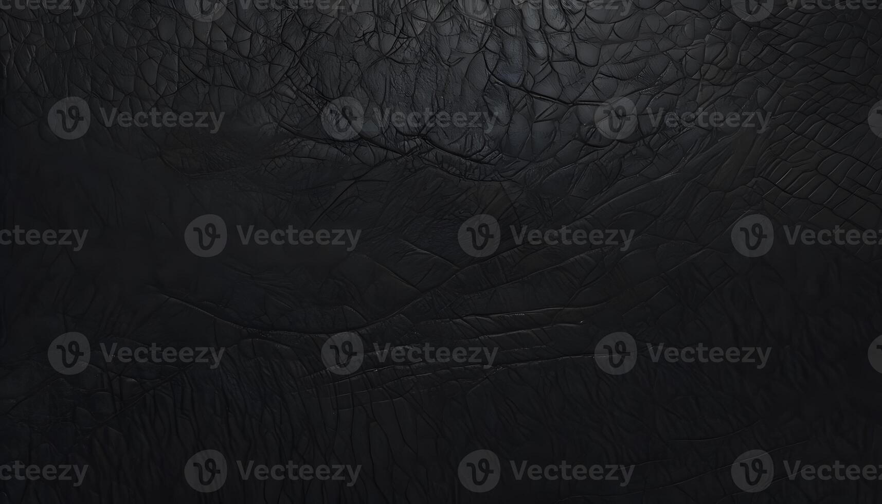 A black background with a texture of a black leather photo
