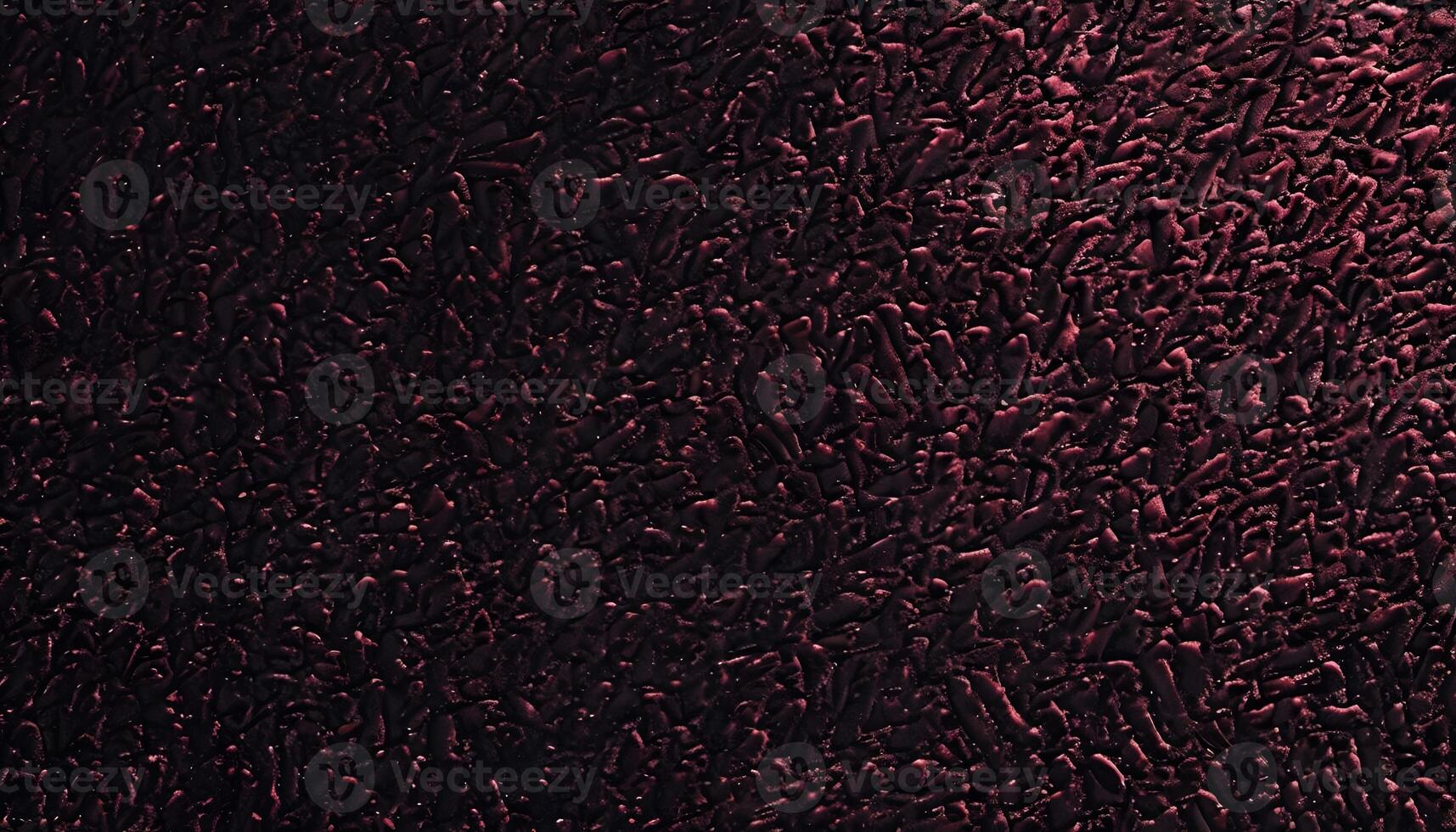 A black background with red paint on it photo