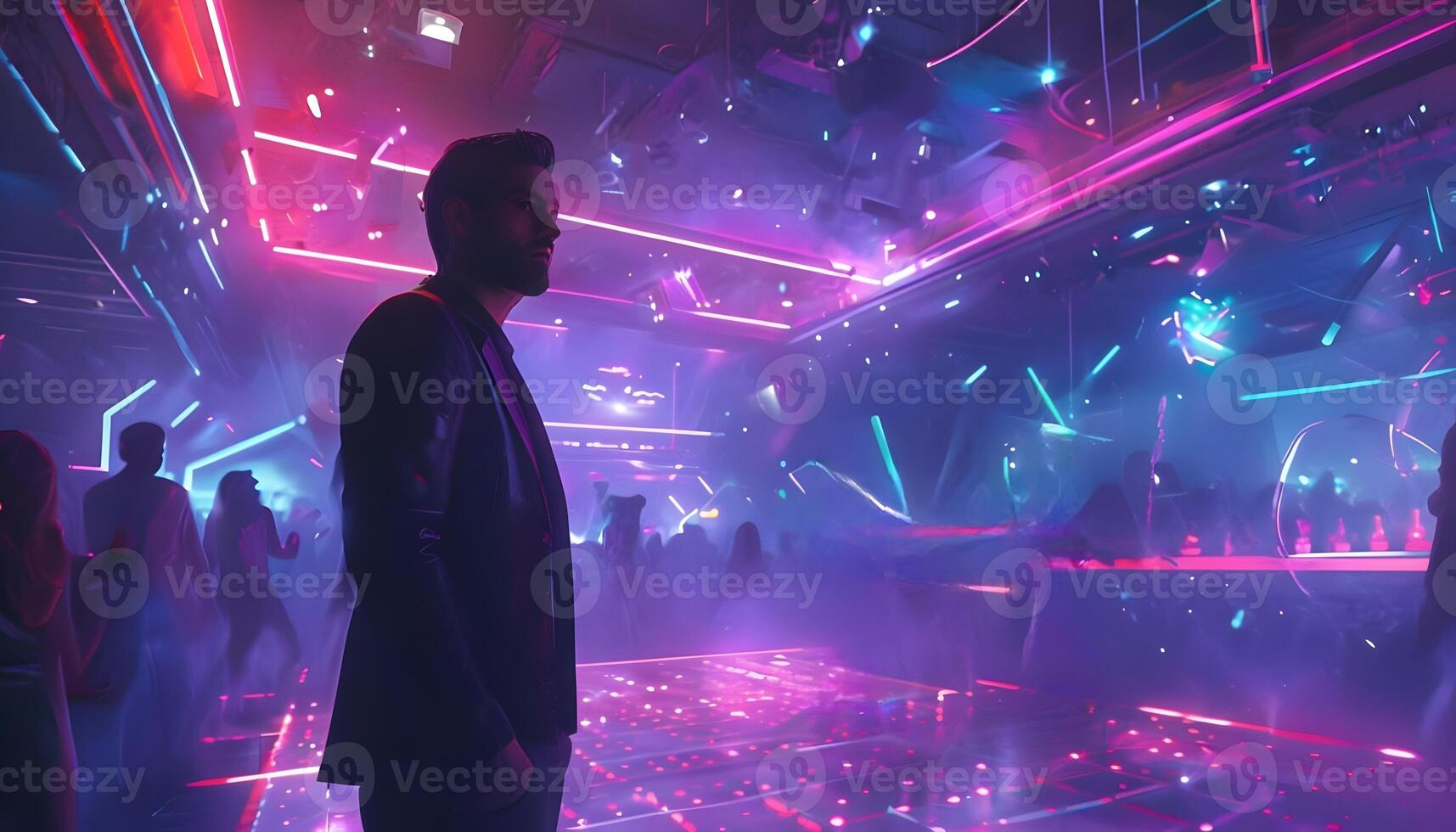 A man standing in front of a neon lit nightclub photo