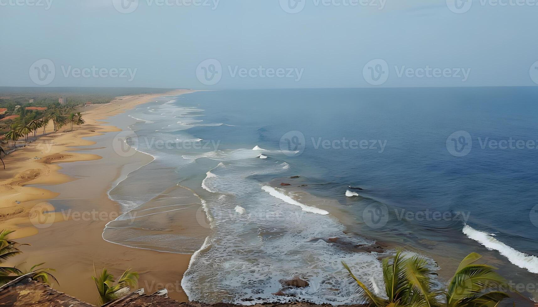 A beach with waves and a small body of water photo