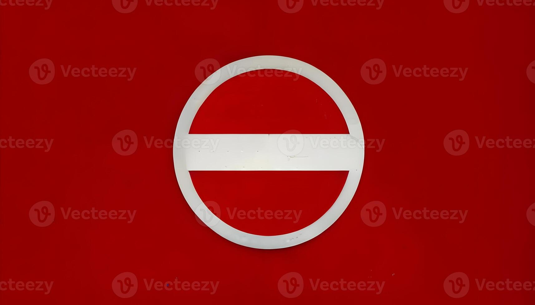 A red and white sign with a circle in the middle photo