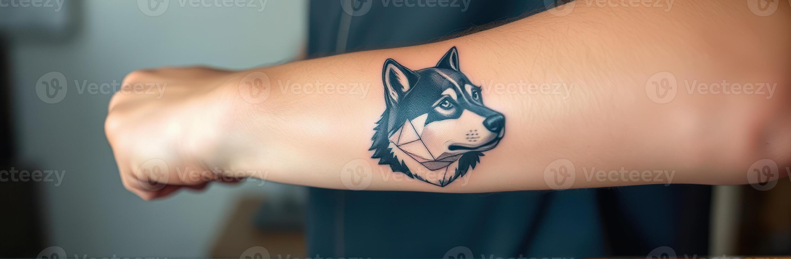Unique geometric wolf tattoo on forearm showcases artistic expression and personal style photo