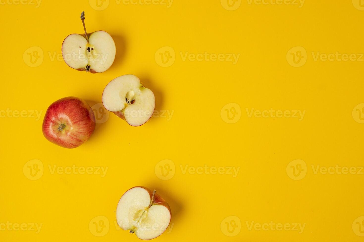 Flat lay composition with Colorful ripe apple fruits on yellow background. Space for text photo